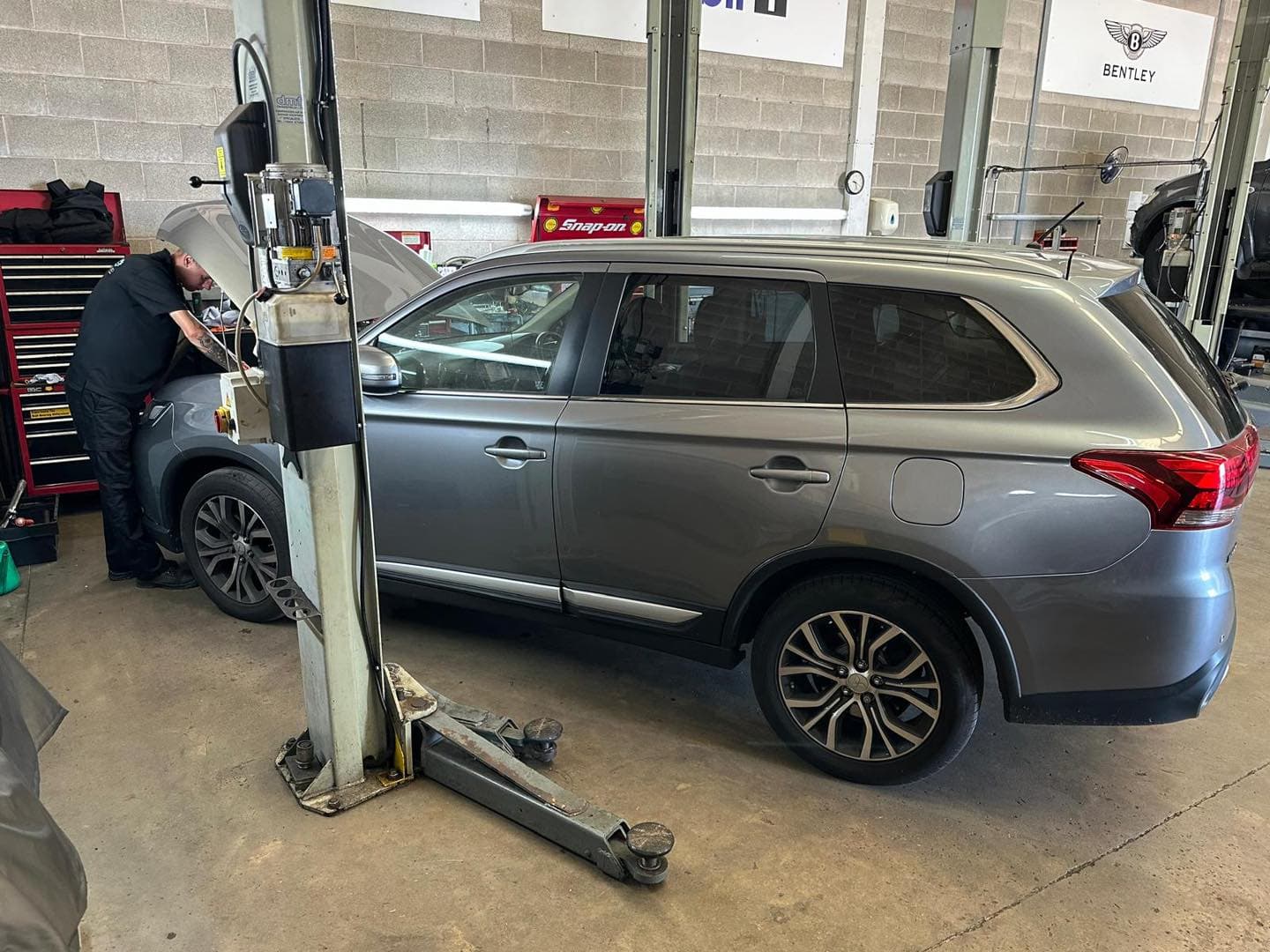 Mitsubishi technician servicing vehicle at Mitsiland Manchester